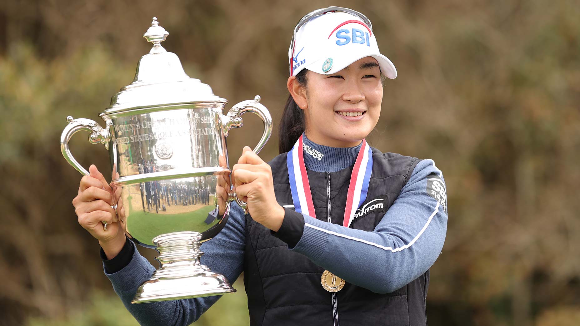 a lim kim holds trophy