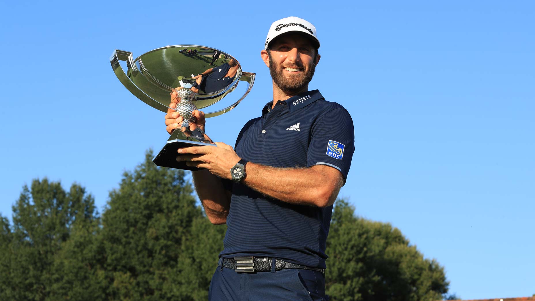 dustin johnson holds fedex cup