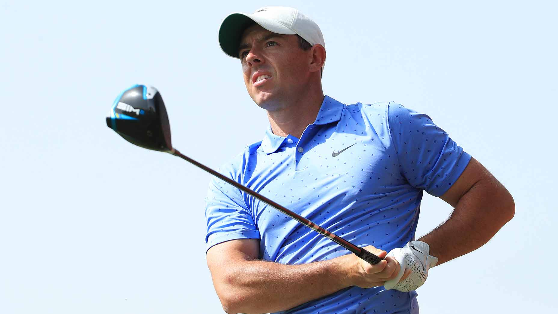 Rory McIlroy tees off in abu dhabi