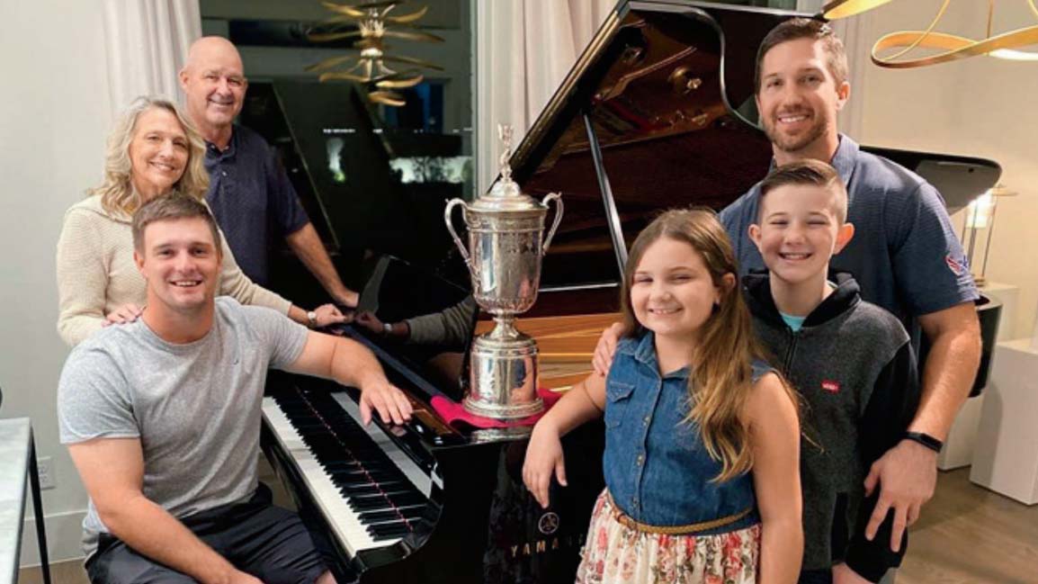 bryson dechambeau poses with his family