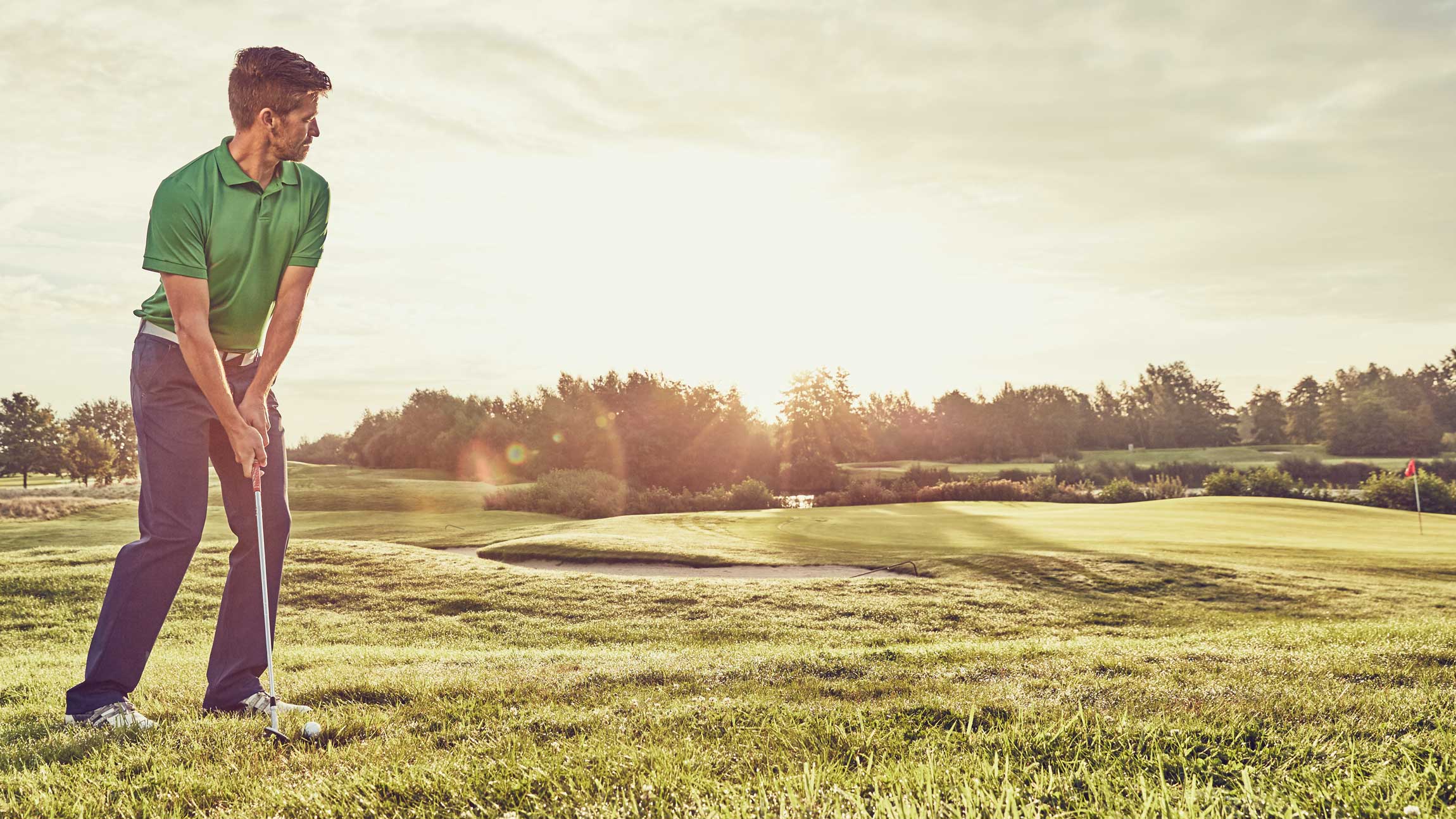 golfer standing over wedge shot