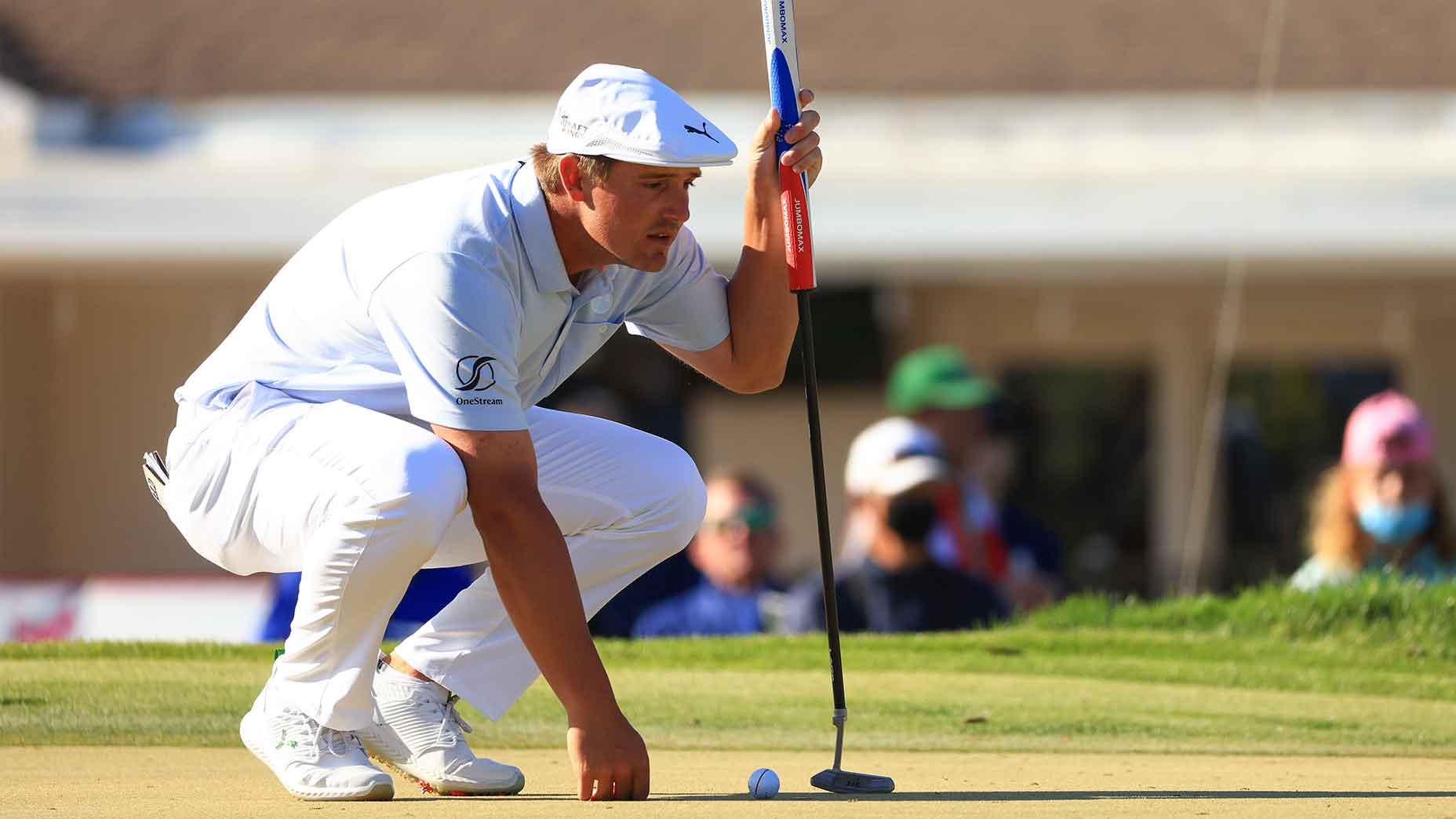 bryson dechambeau lines up putt bay hill