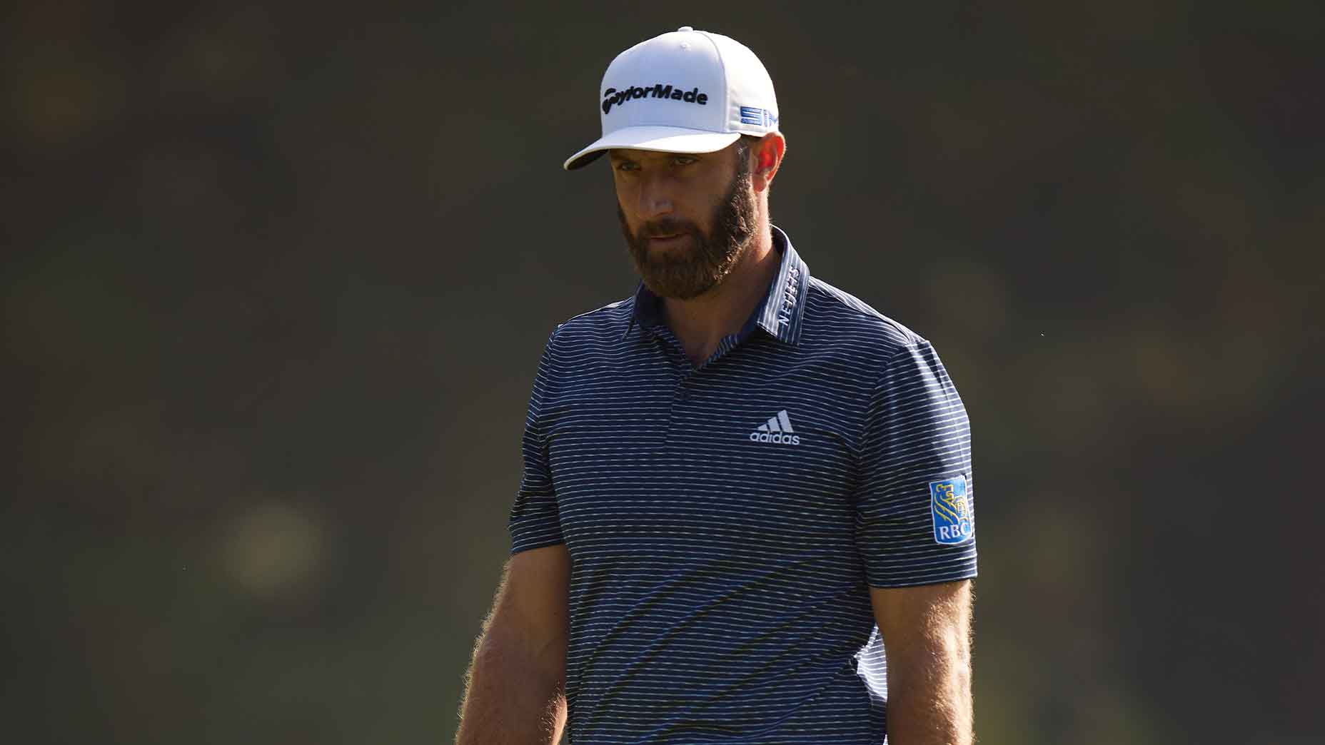 dustin johnson walks masters