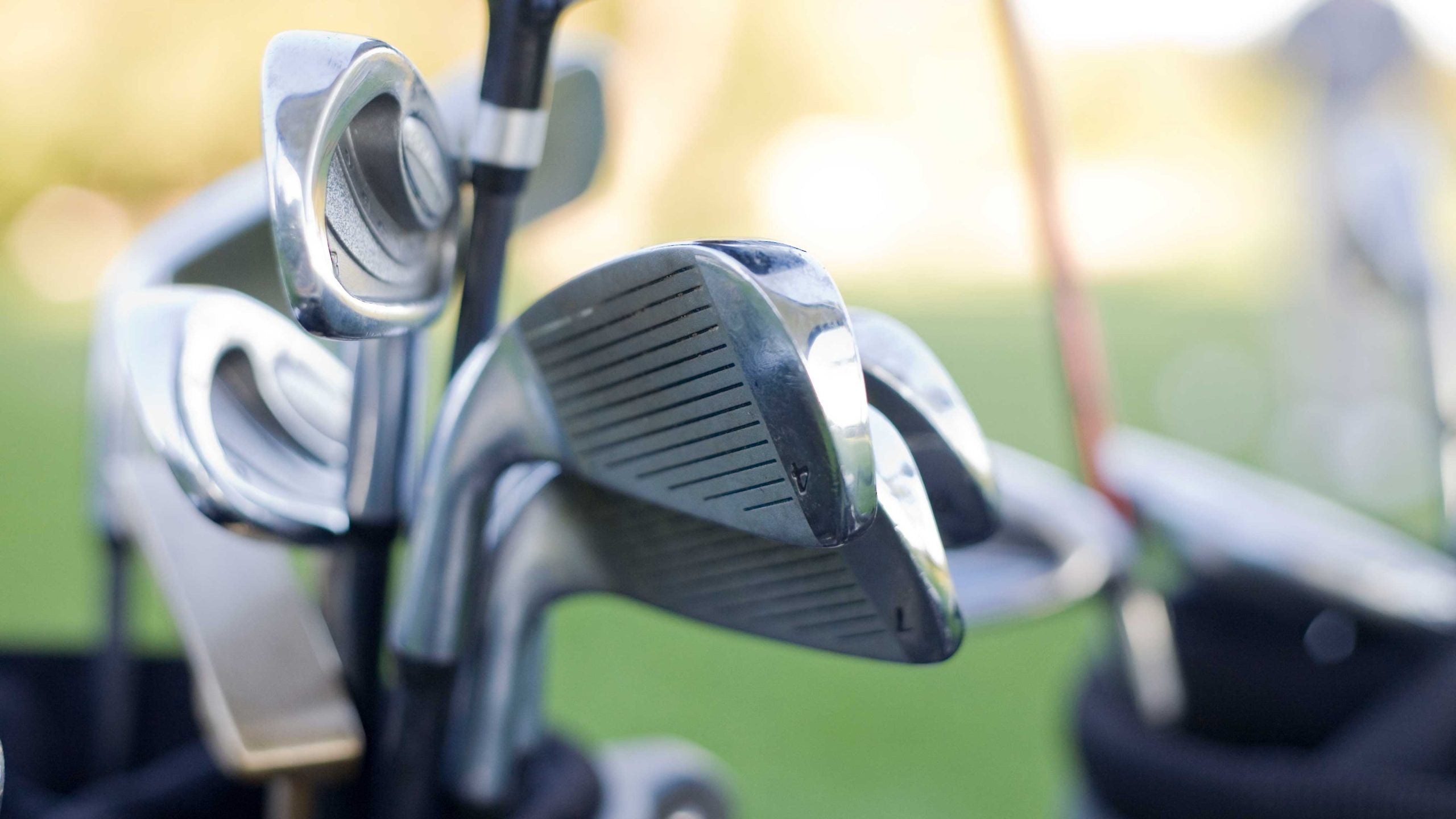 irons in a golf bag