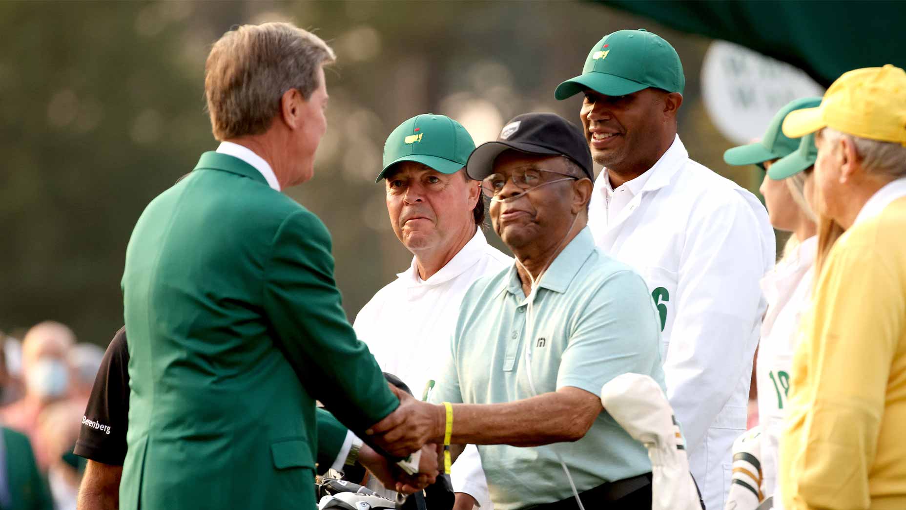 lee elder shakes fred ridley's hand