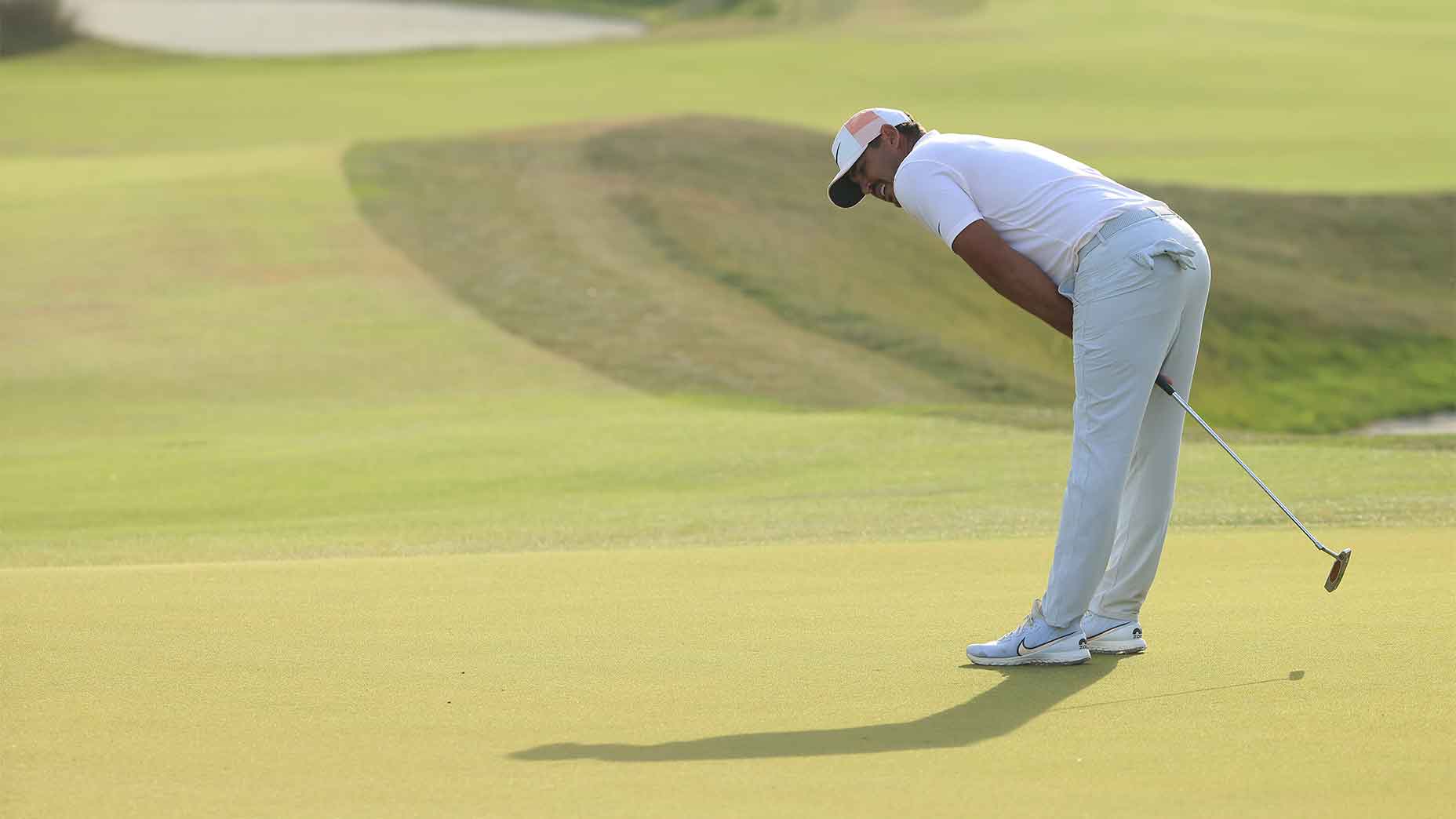 brooks koepka leans over putter