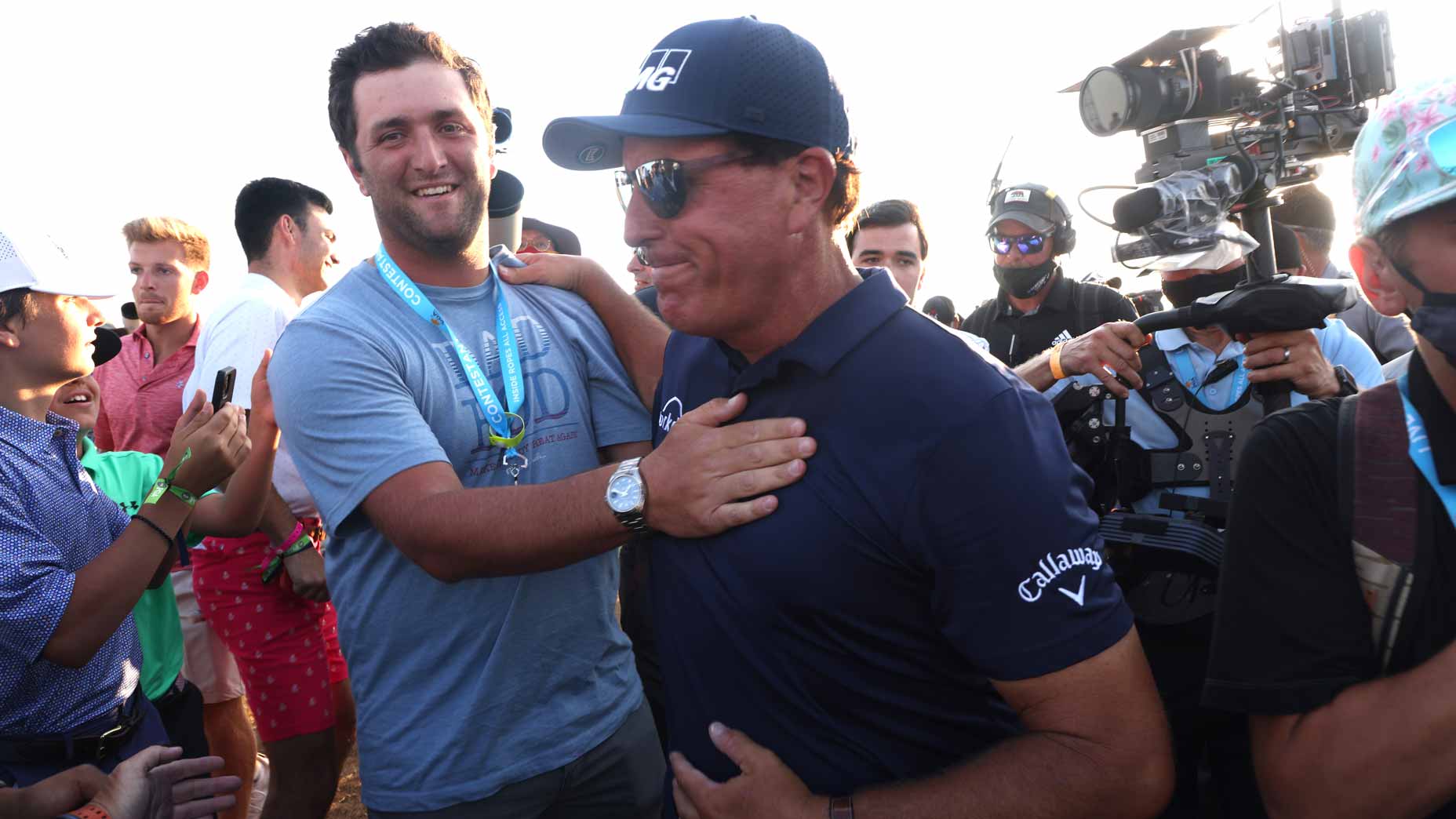 jon rahm congratulates phil mickelson