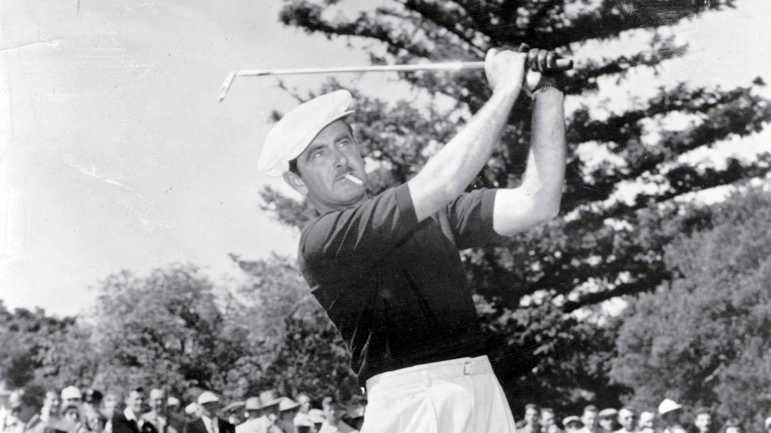 Lloyd Mangrum, winner of the 1946 U.S. Open Championship, hits a shot.
