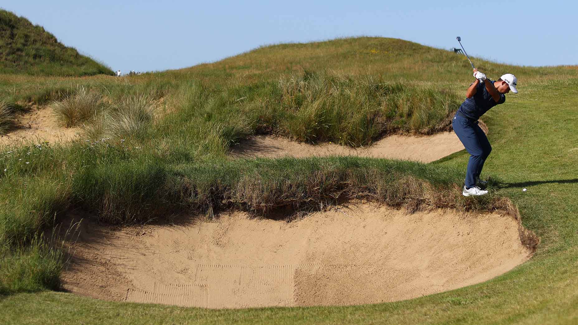 Collin morikawa hits an approach to the 5th hole at royal st georges