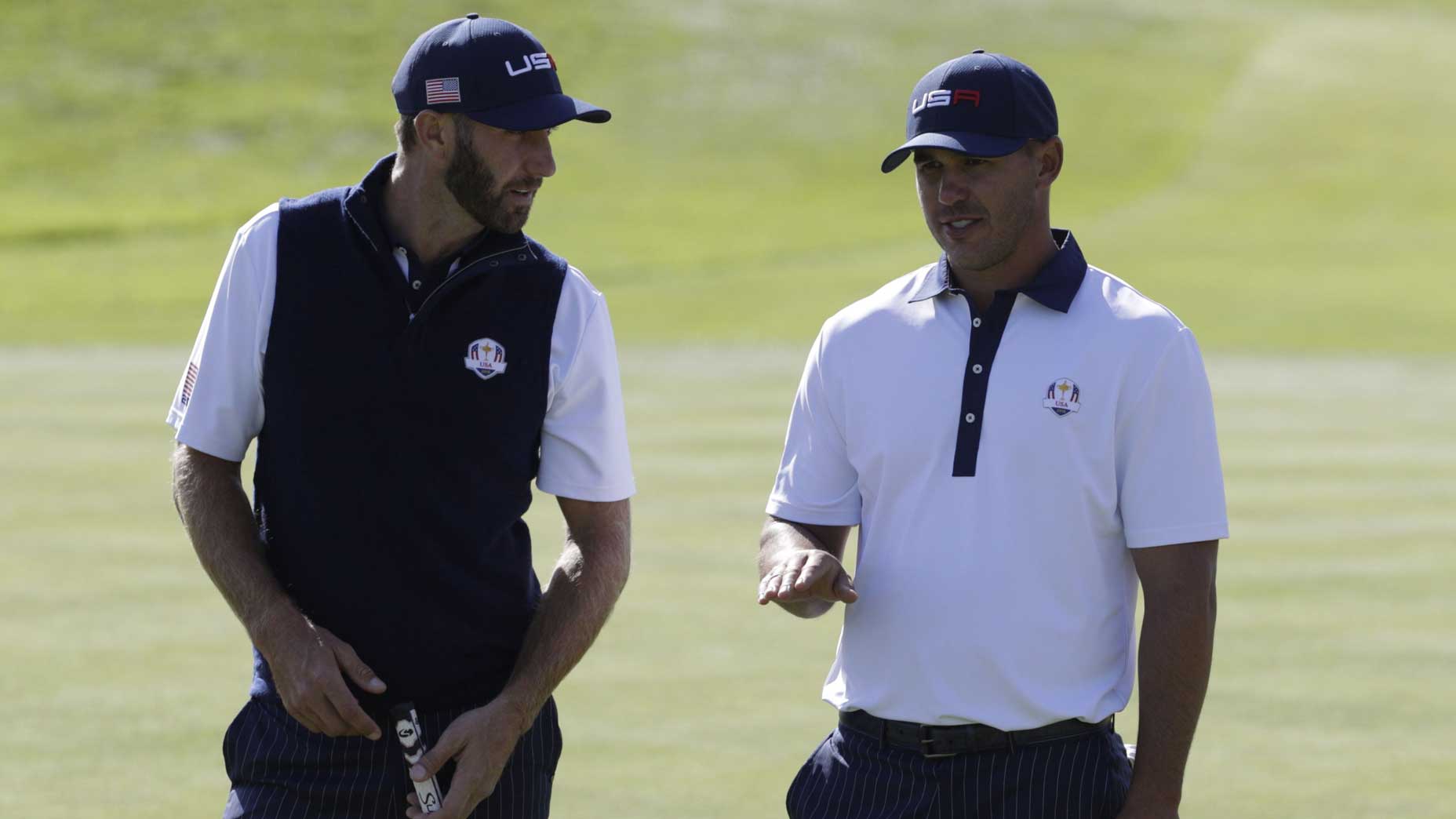 brooks koepka talks to dustin johnson