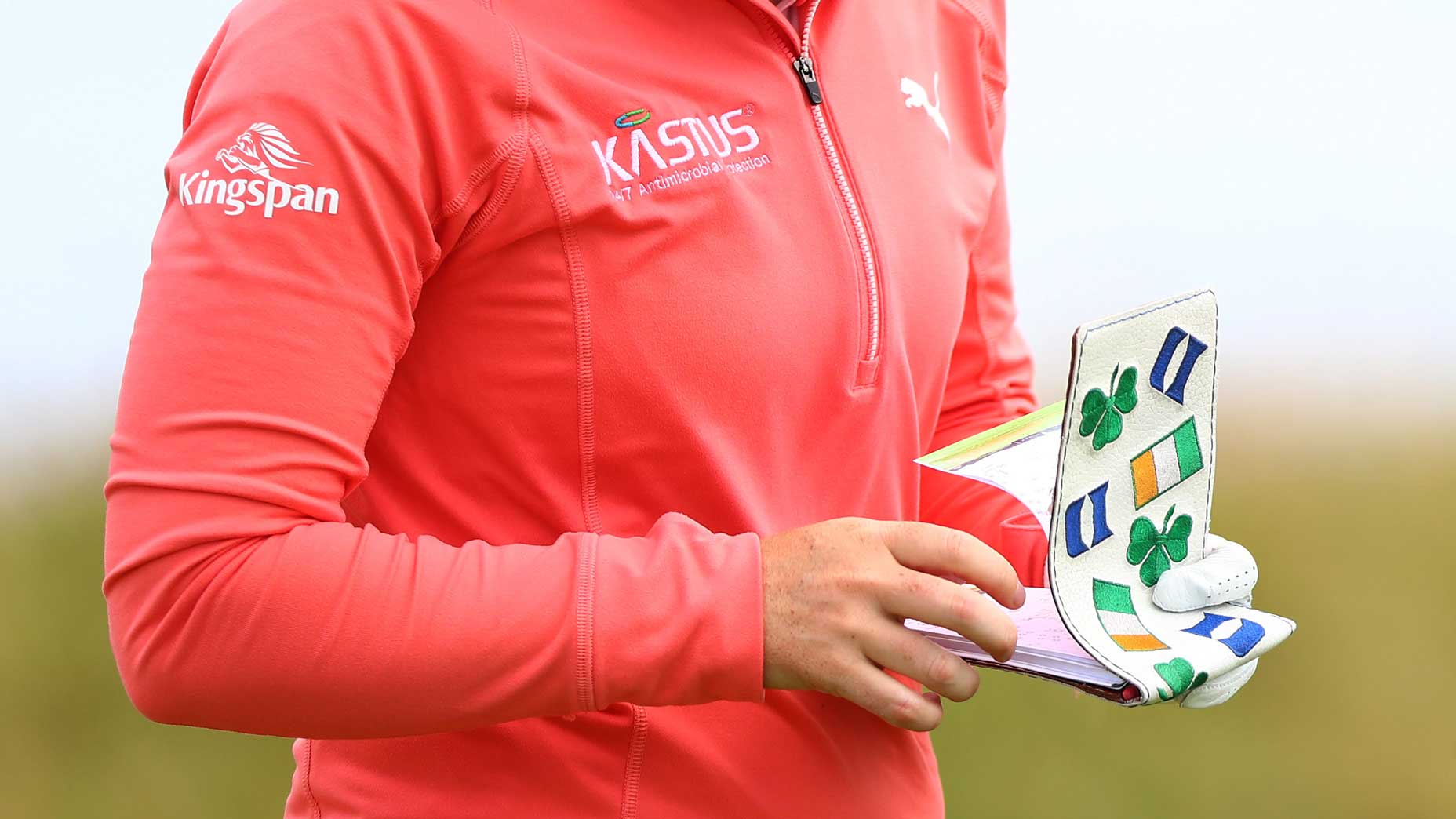 golfer reads yardage book