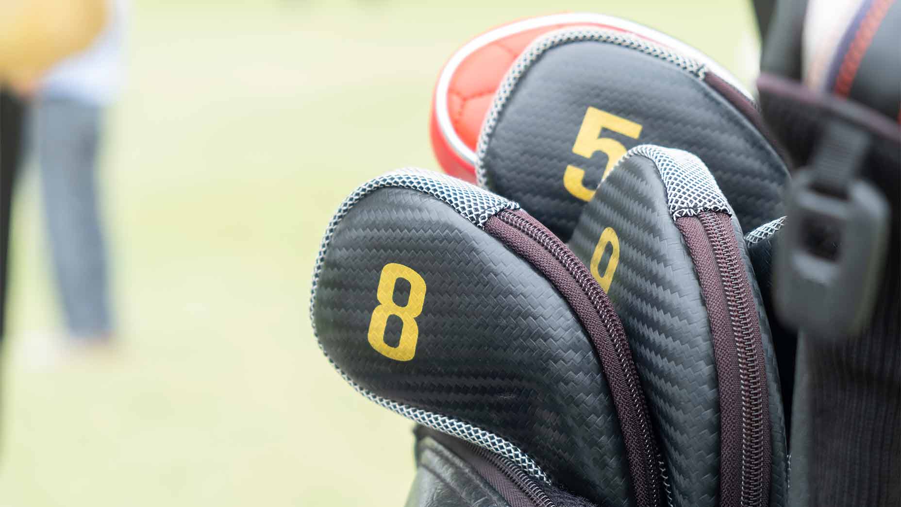 Iron covers on a golf bag.