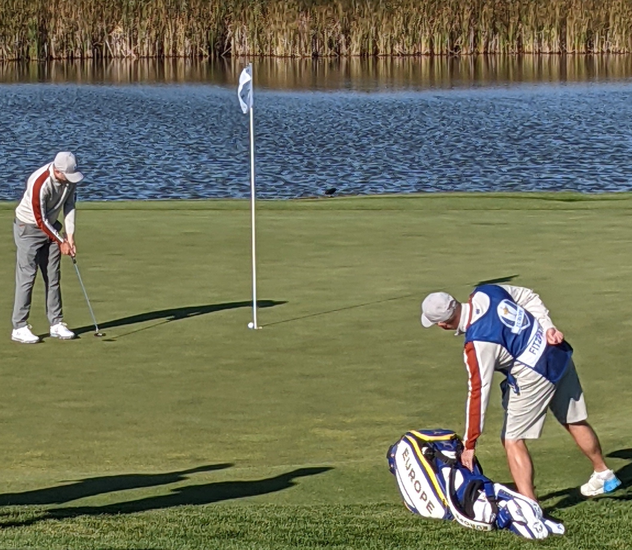 Matthew Fitzpatrick, putting with the flagstick in.