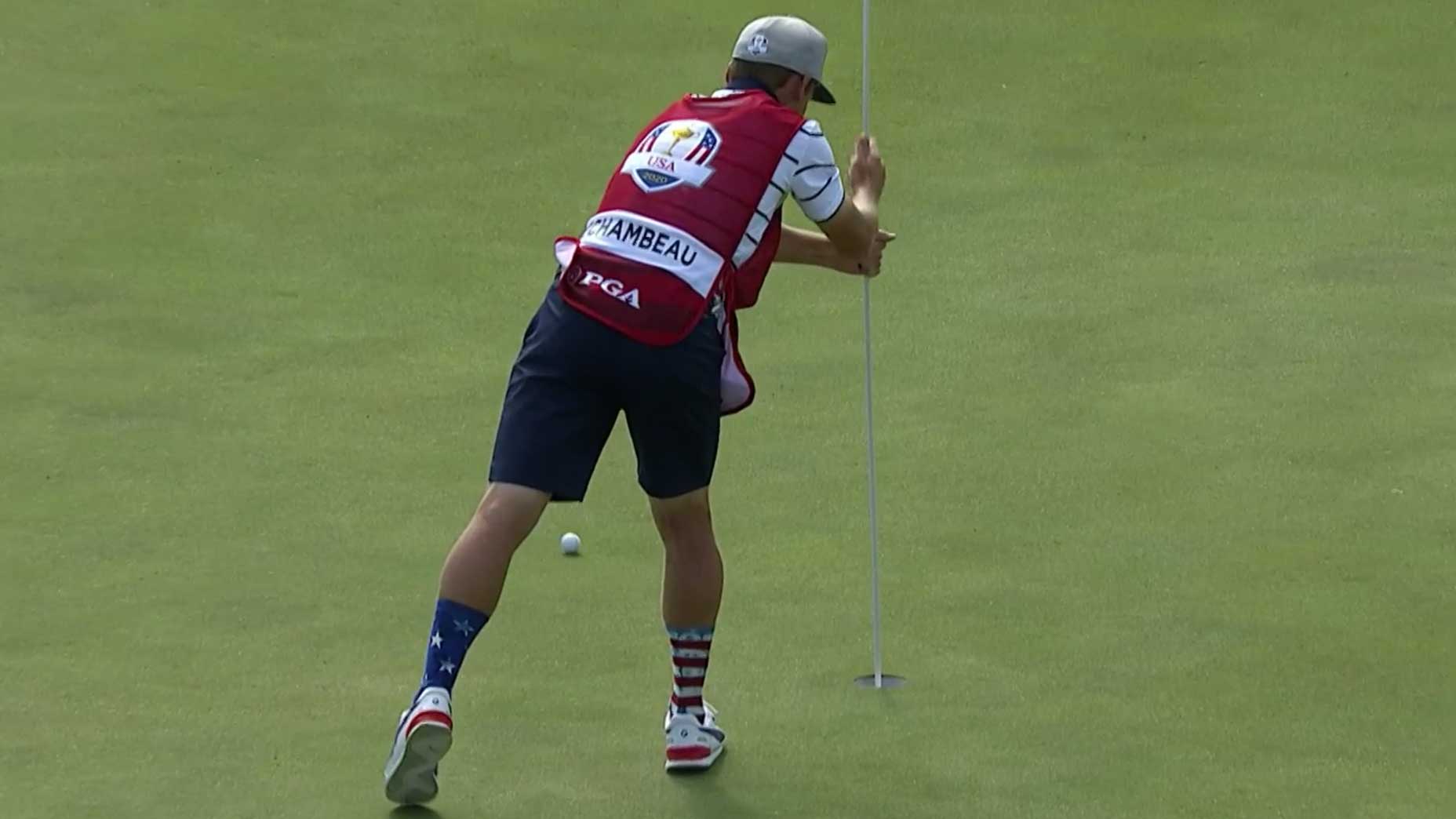 bryson's caddie with flagstick