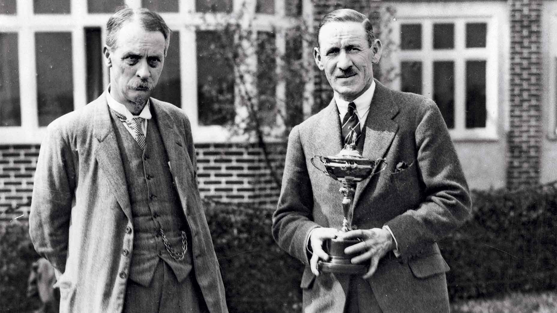 Sam Ryder with his instructor, pro Abe Mitchell (right), whose likeness was used for the Ryder Cup.