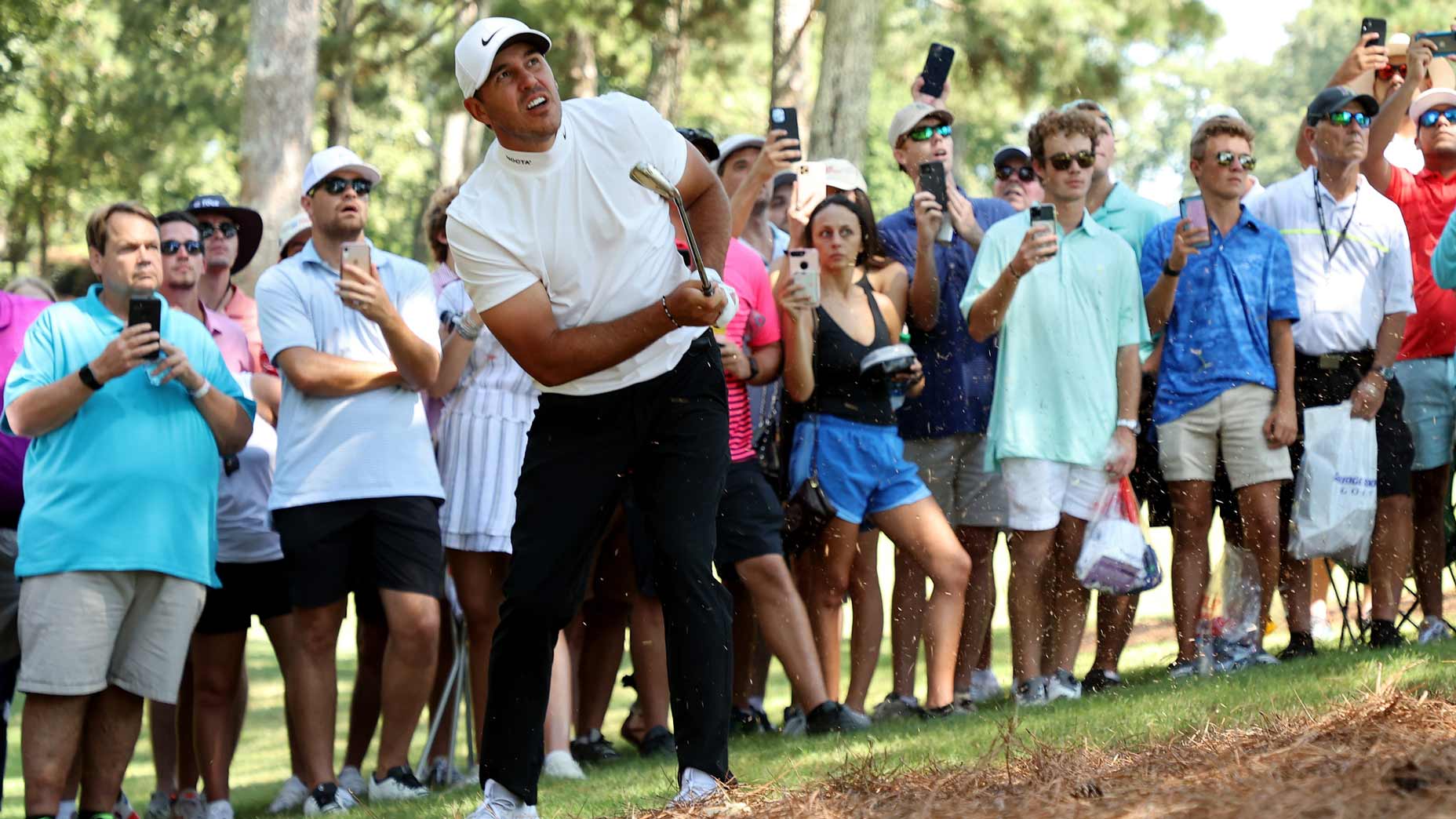 Brooks Koepka plays a golf shot during the 2021 Tour Championship at East Lake