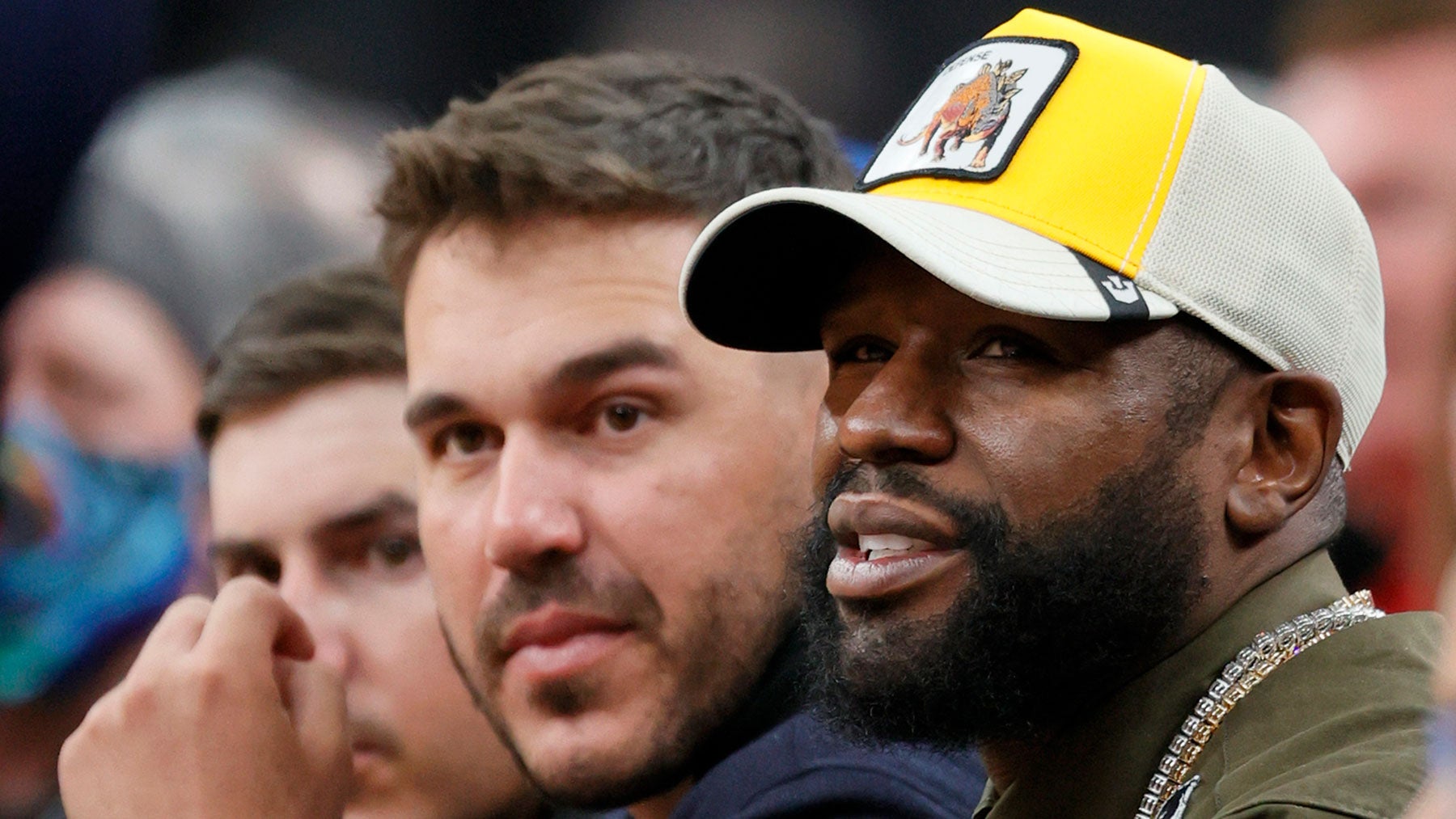 Golfer Brooks Koepka (L) and boxing promoter Floyd Mayweather Jr. attend the Continental Tire Challenge between the Duke Blue Devils and the Gonzaga Bulldogs at T-Mobile Arena on November 26, 2021 in Las Vegas, Nevada. The Blue Devils defeated the Bulldogs 84-81.
