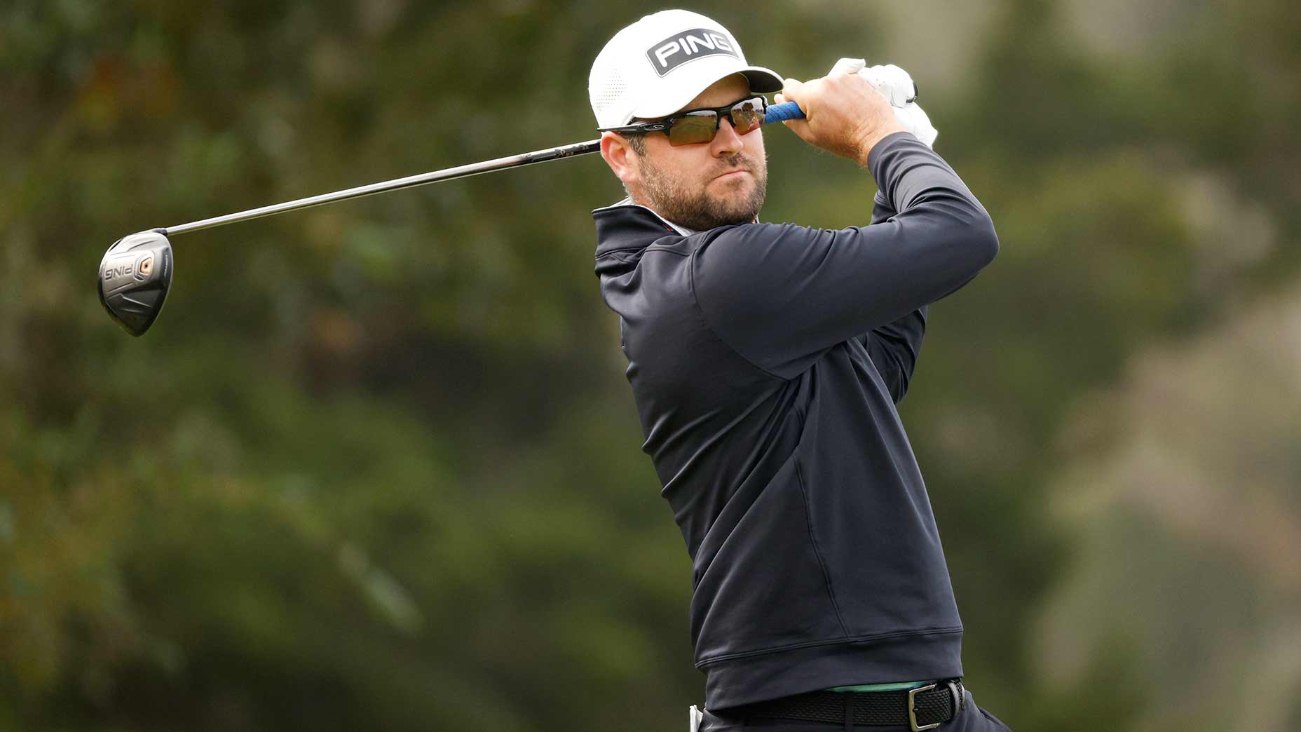 Corey Conners tees off.