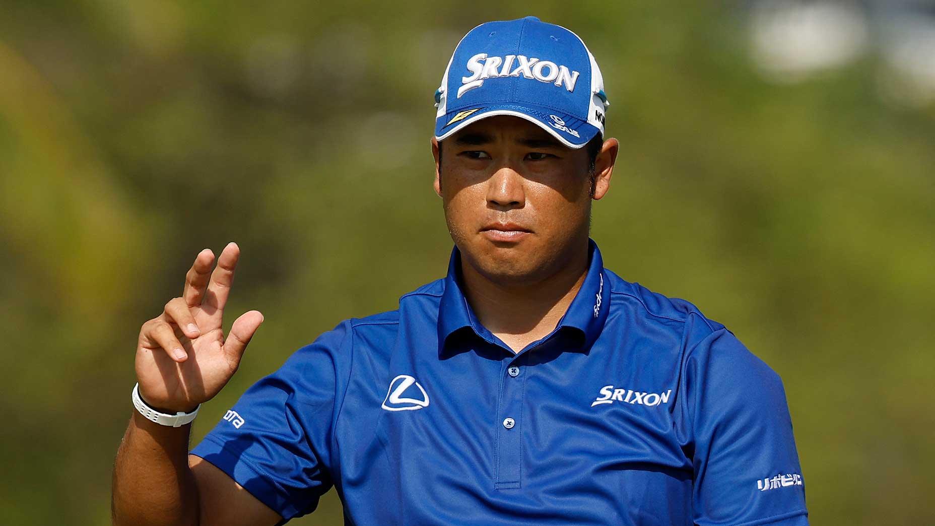 Hideki Matsuyama waves at crowd