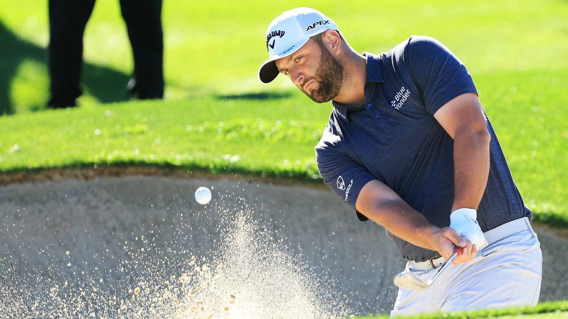 Jon Rahm plays bunker shot during 2022 American Express