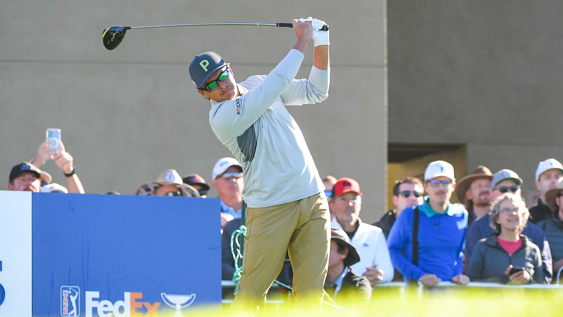 Rickie Fowler hits tee shot during first round of 2022 Farmers Insurance Open