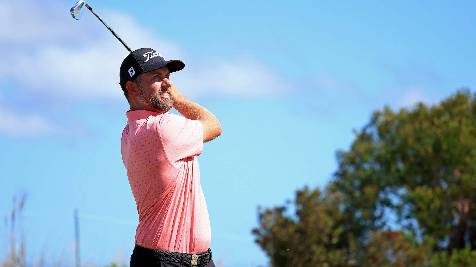 Webb Simpson hits shot during golf tournament