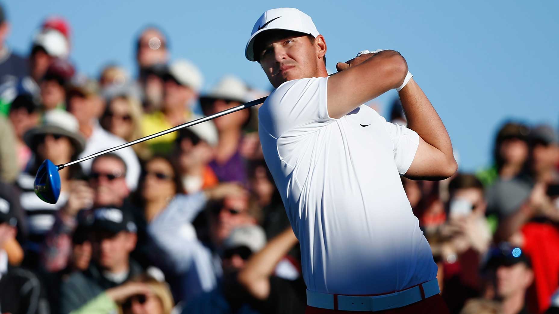 Brooks Koepka hits tee shot during 2021 WM Phoenix Open