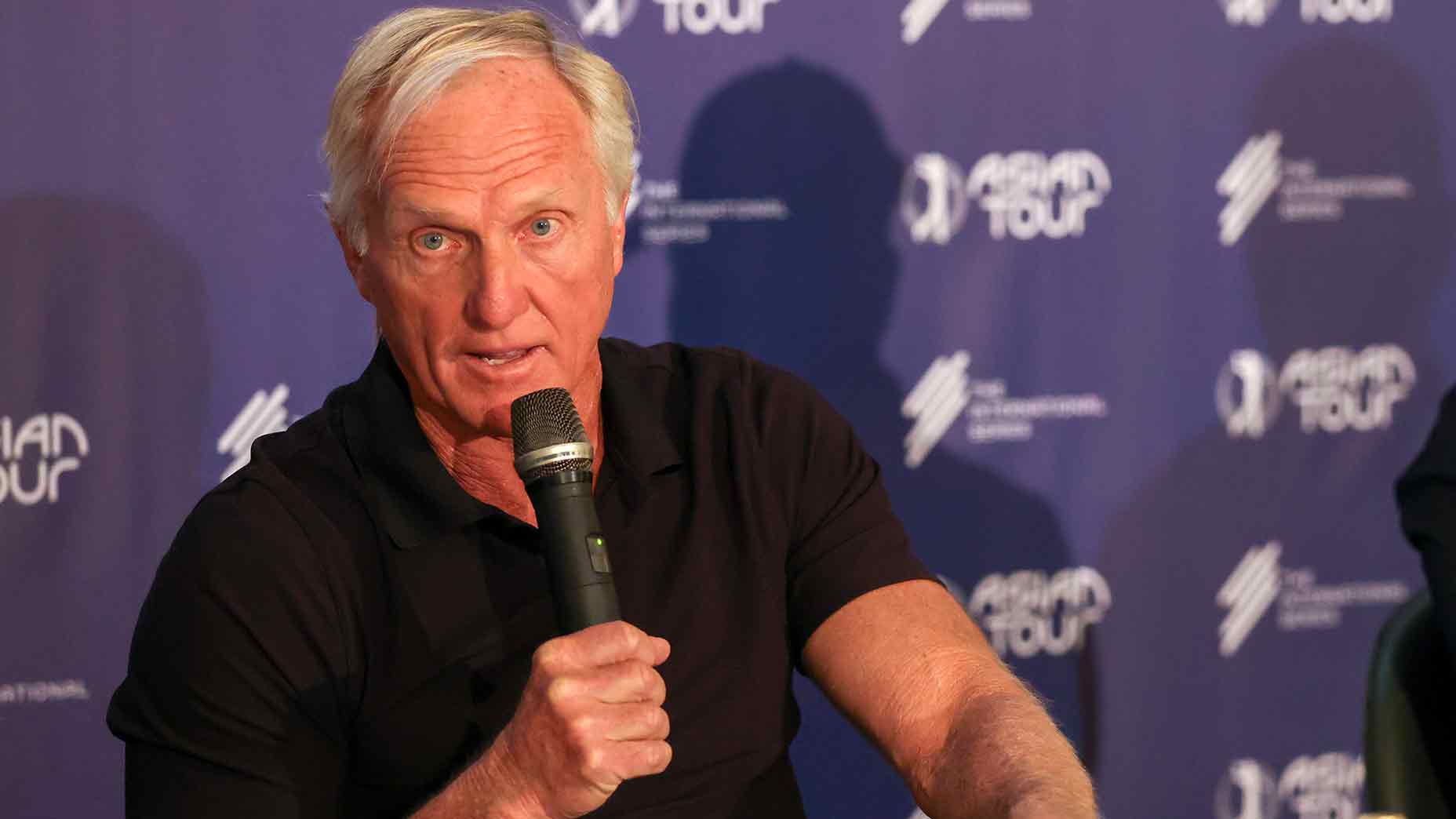 Greg Norman at a press conference for the newly formed 'International Series.'