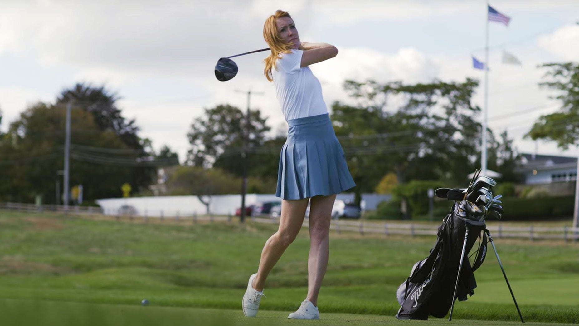 Golf instructor Trillium Rose hits shot