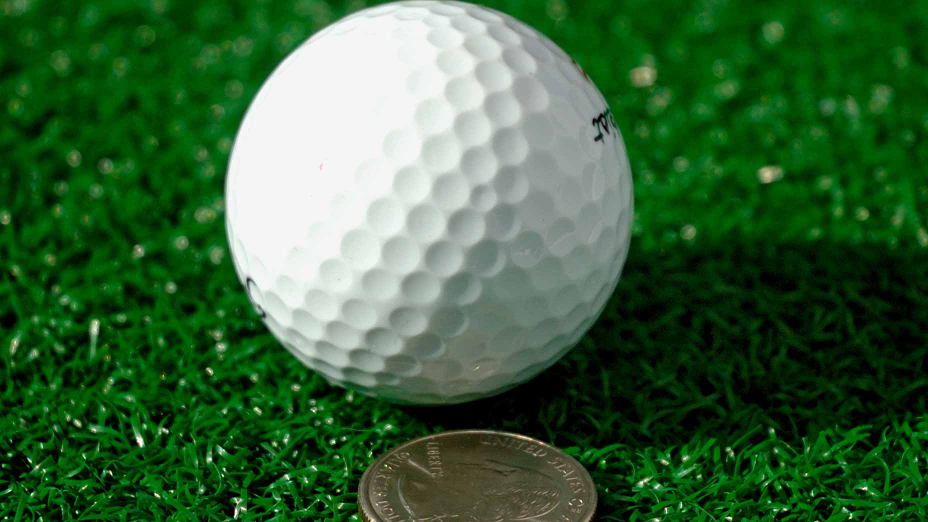 quarter and golf ball