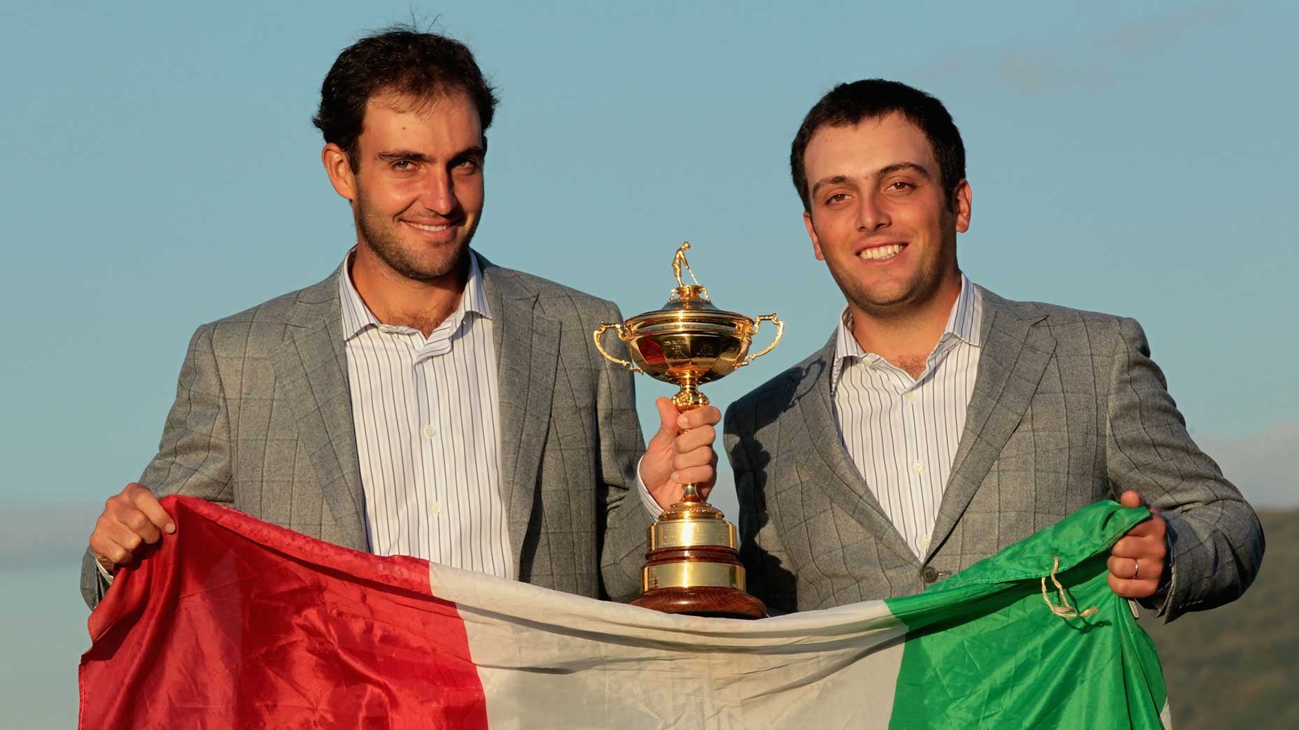 edoardo molinari and francesco molinari with italian flag and ryder cup trophy
