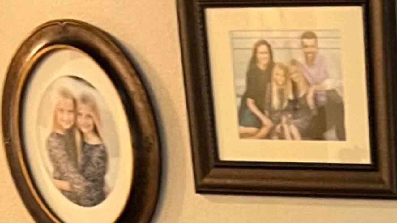 Photos on the wall behind JT
