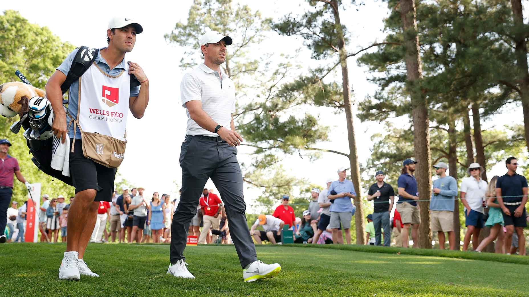 Rory McIlroy and caddie walk together at 2021 Wells Fargo Championship