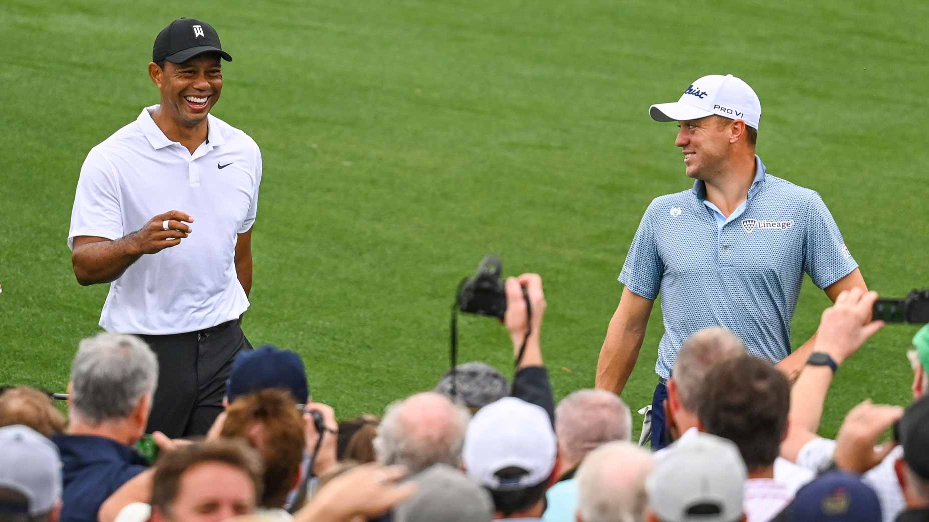 Tiger Woods and Justin Thomas walk during practice round at 2022 Masters