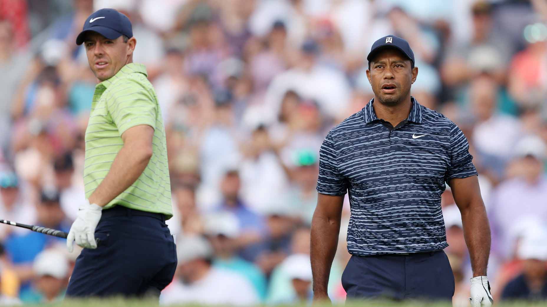 Rory McIlroy and Tiger Woods stand on tee at 2022 PGA Championship