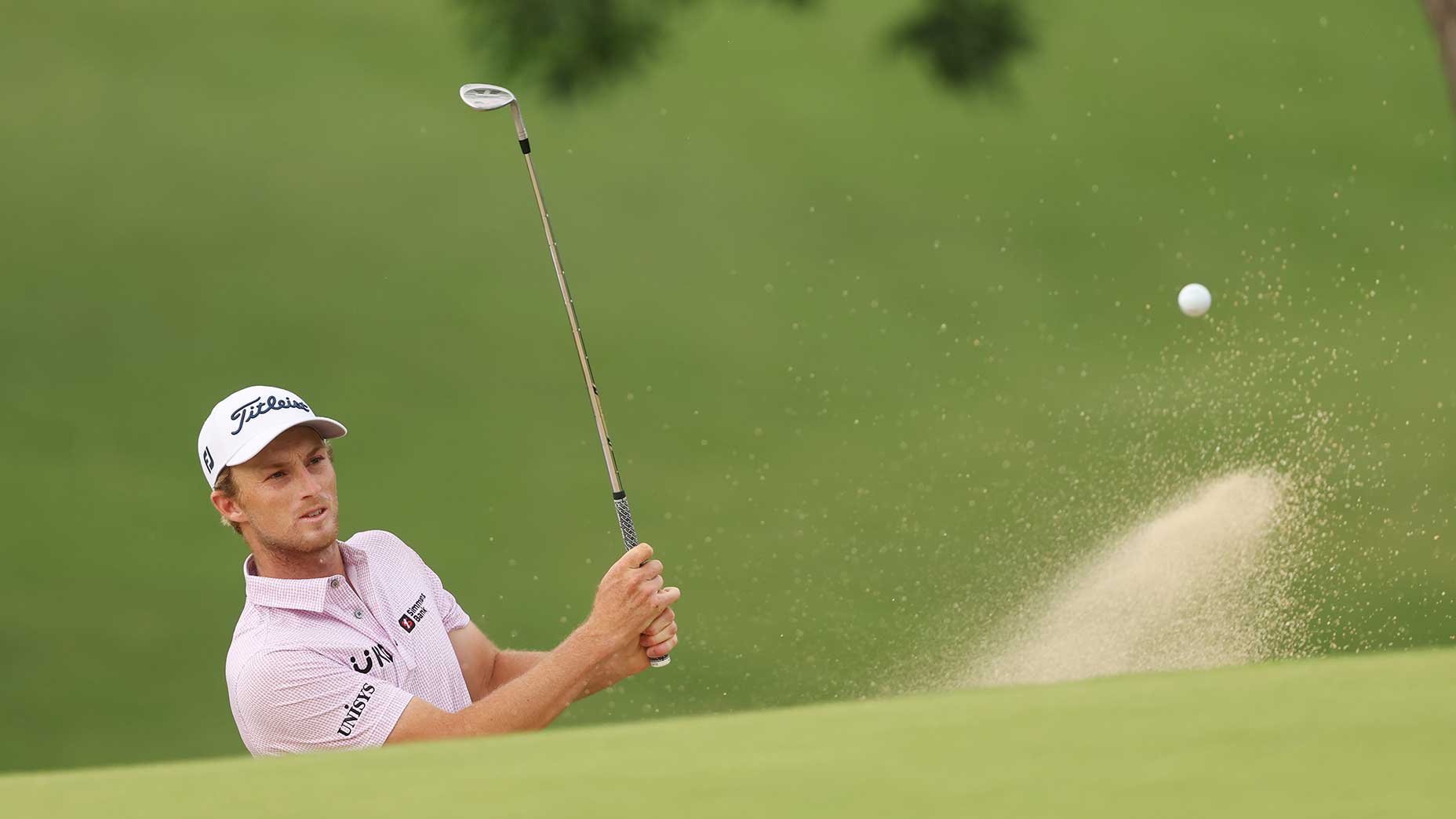 Will Zalatoris blasts out of a bunker.