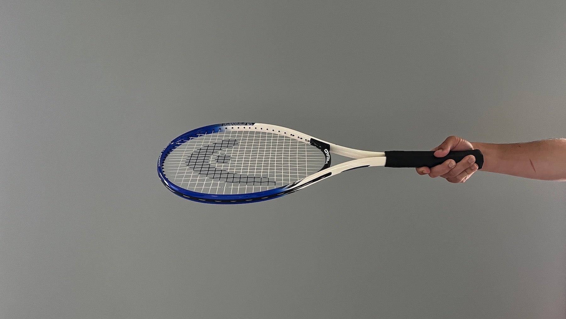 Tennis racket held at angle