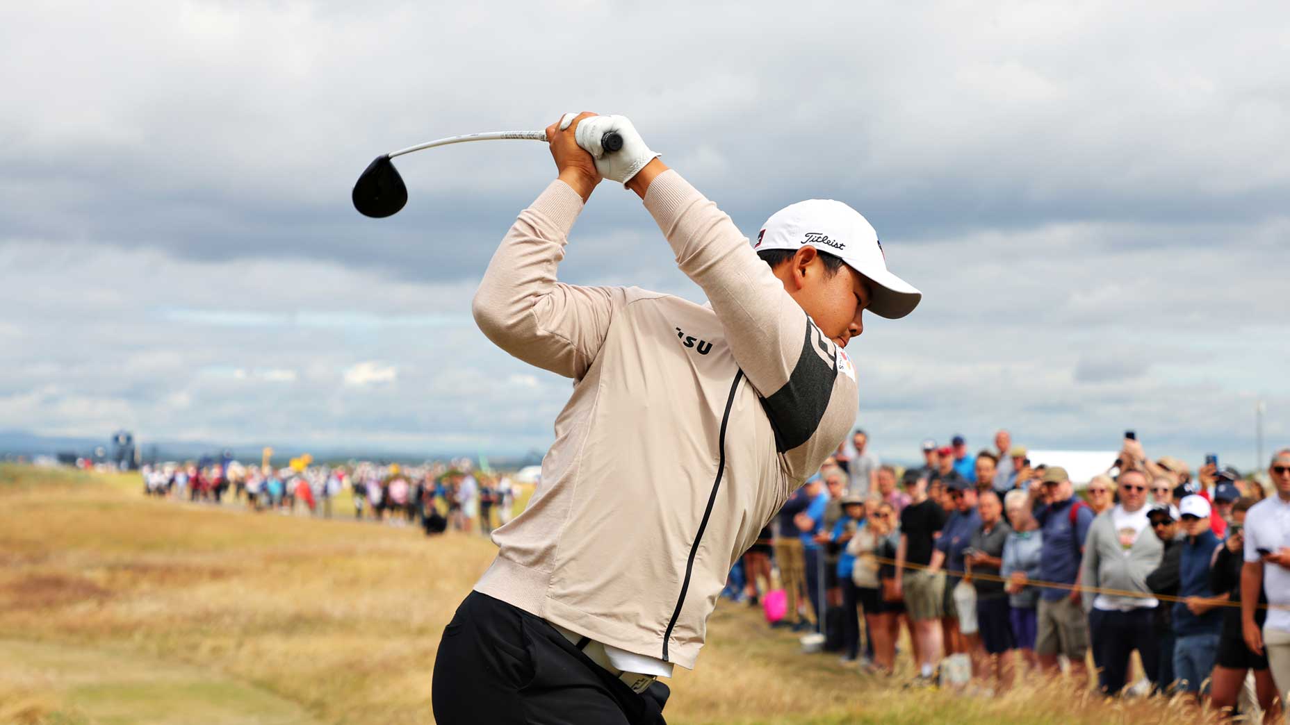 Tom Kim hits drive at 2022 Open Championship