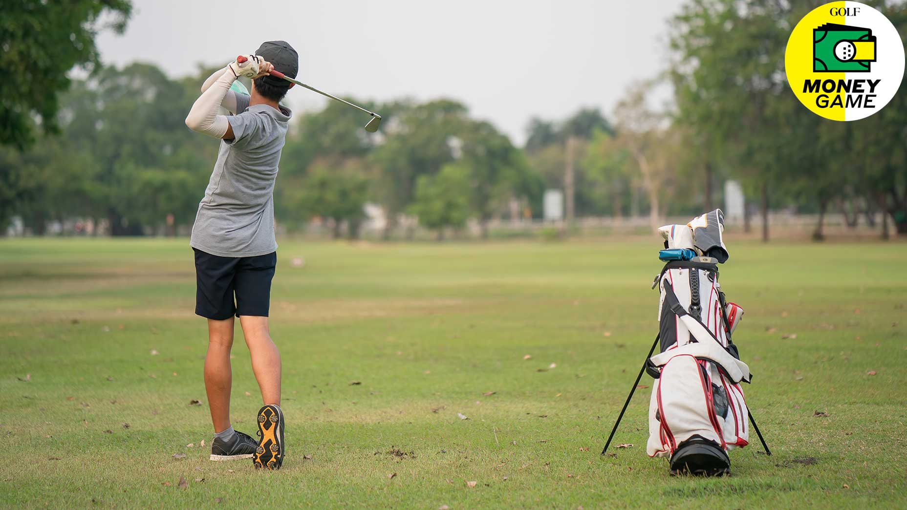A junior golfer takes a swing.