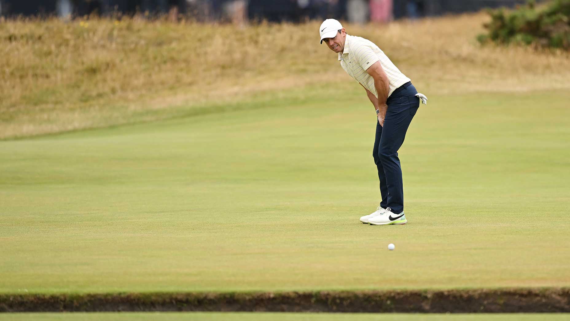 Rory McIlroy watches a putt miss the hole at the british open.