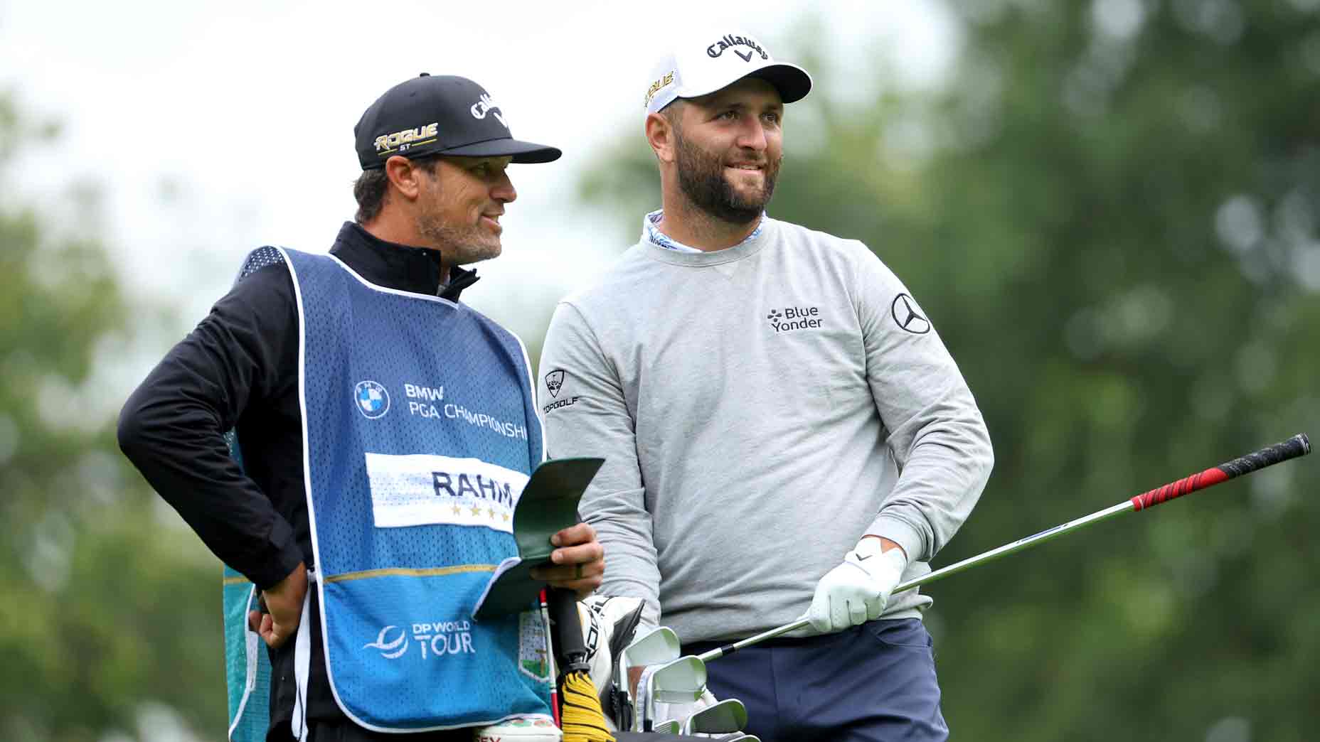 Jon Rahm with his caddie