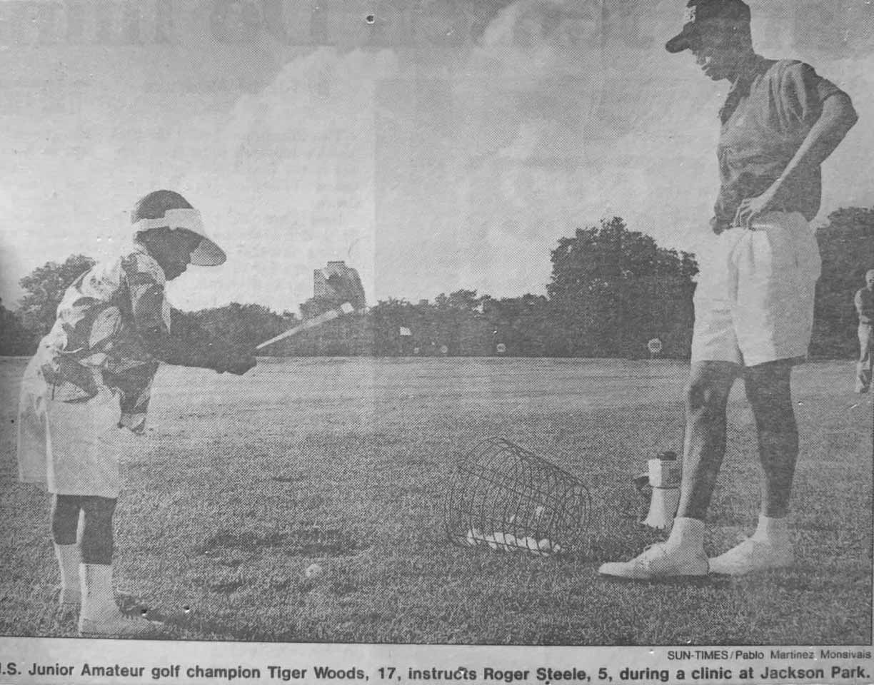 Roger Steele getting a lesson from Tiger Woods in 1993.
