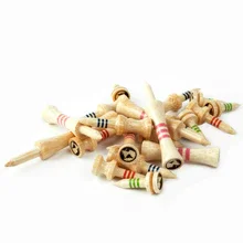 Multiple golf tees in green and red accents. The tees are tan bamboo.