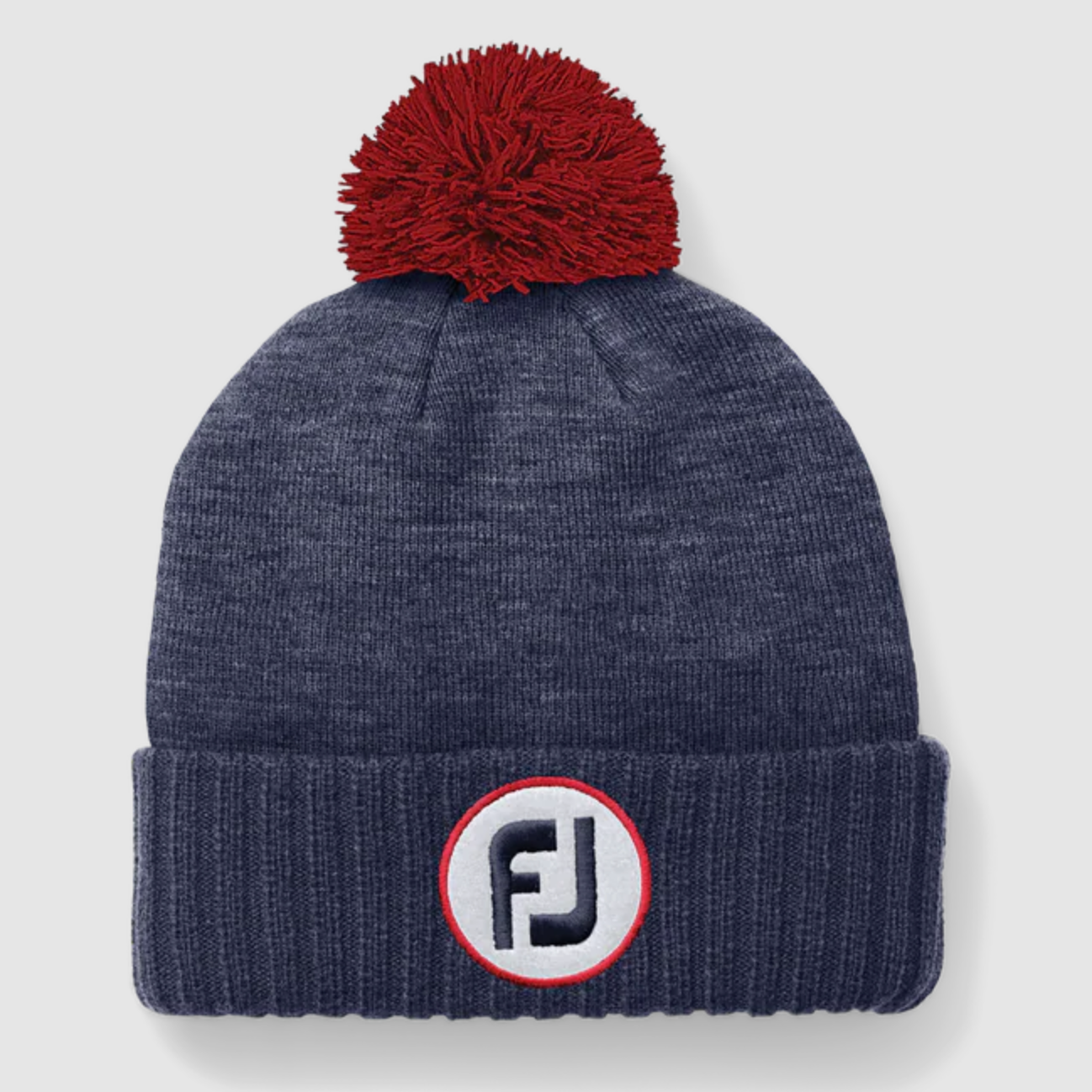 Dark blue pom pom hat with red pom pom