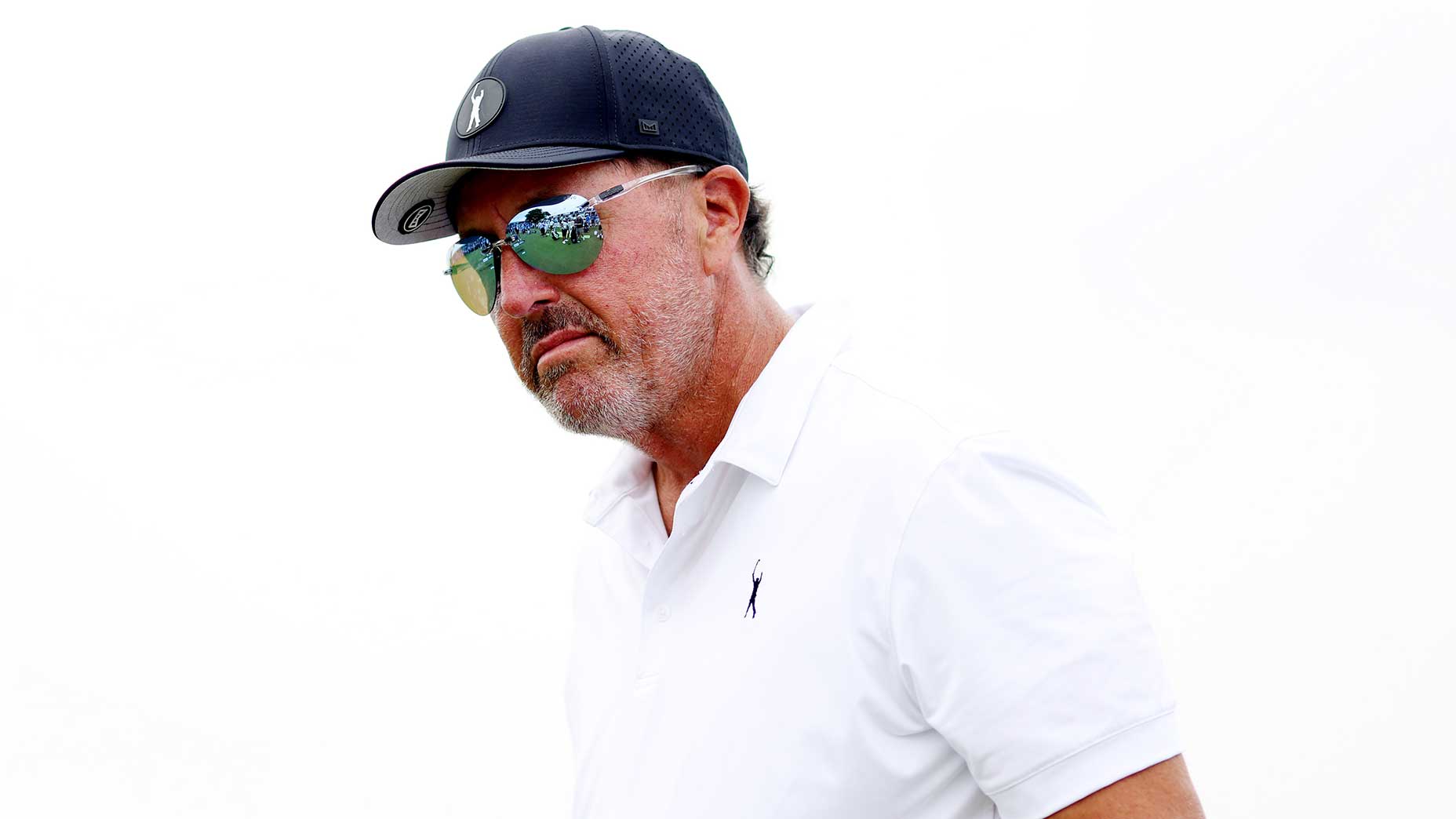 phil mickelson looks on at a golf tournament