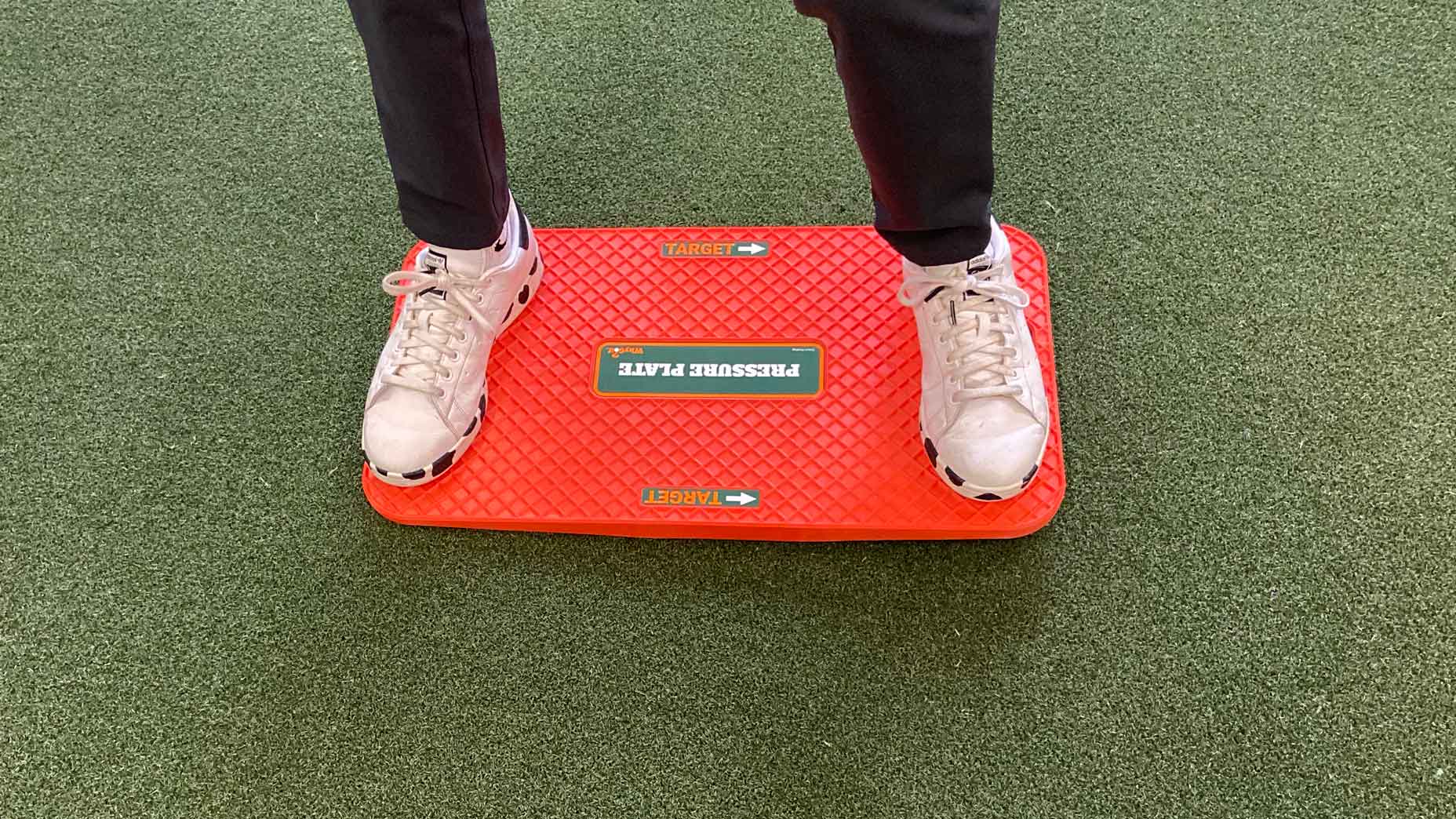 feet standing on pressure plate