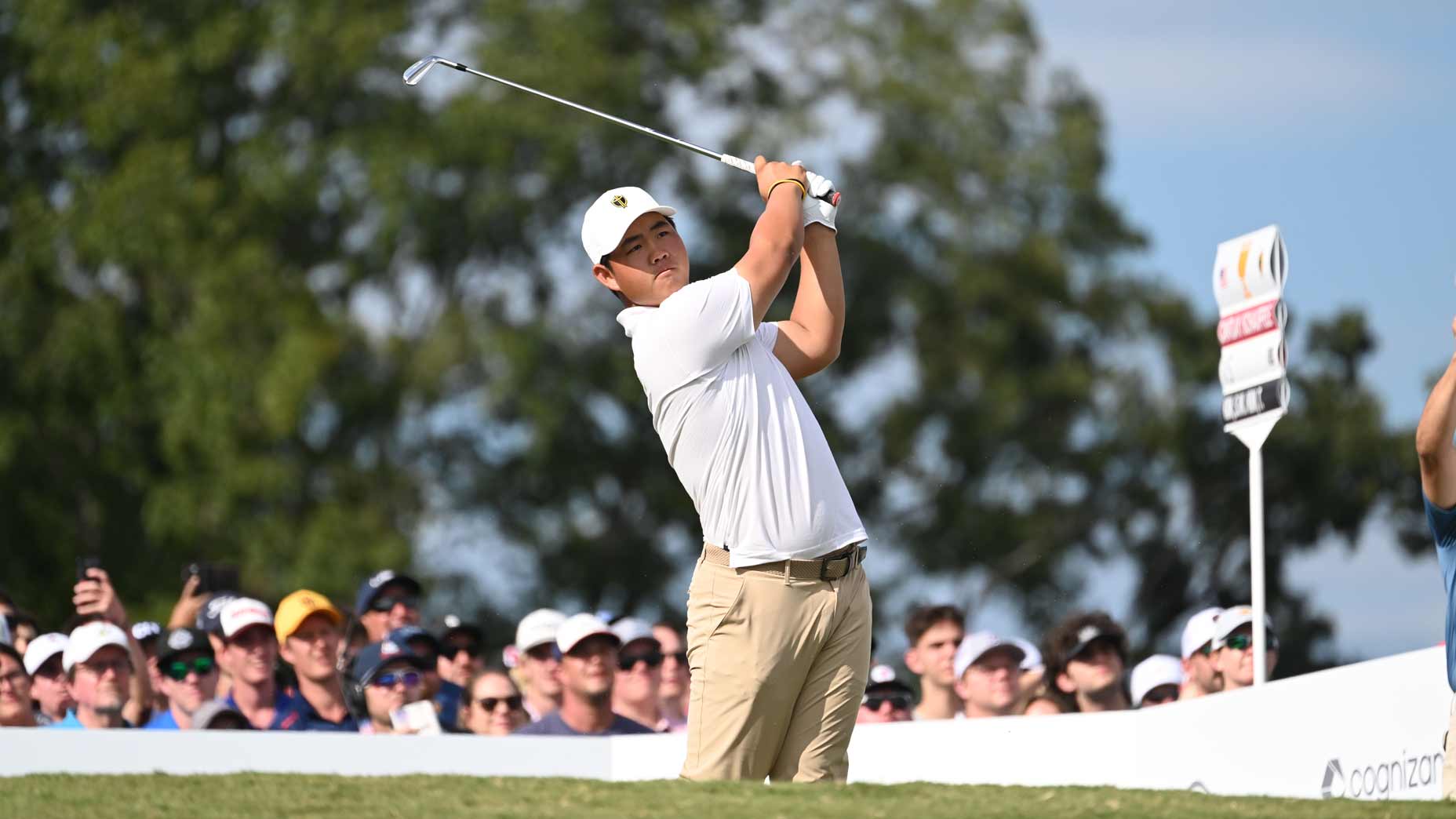 Tom Kim hits tee shot with iron at 2022 Presidents Cup