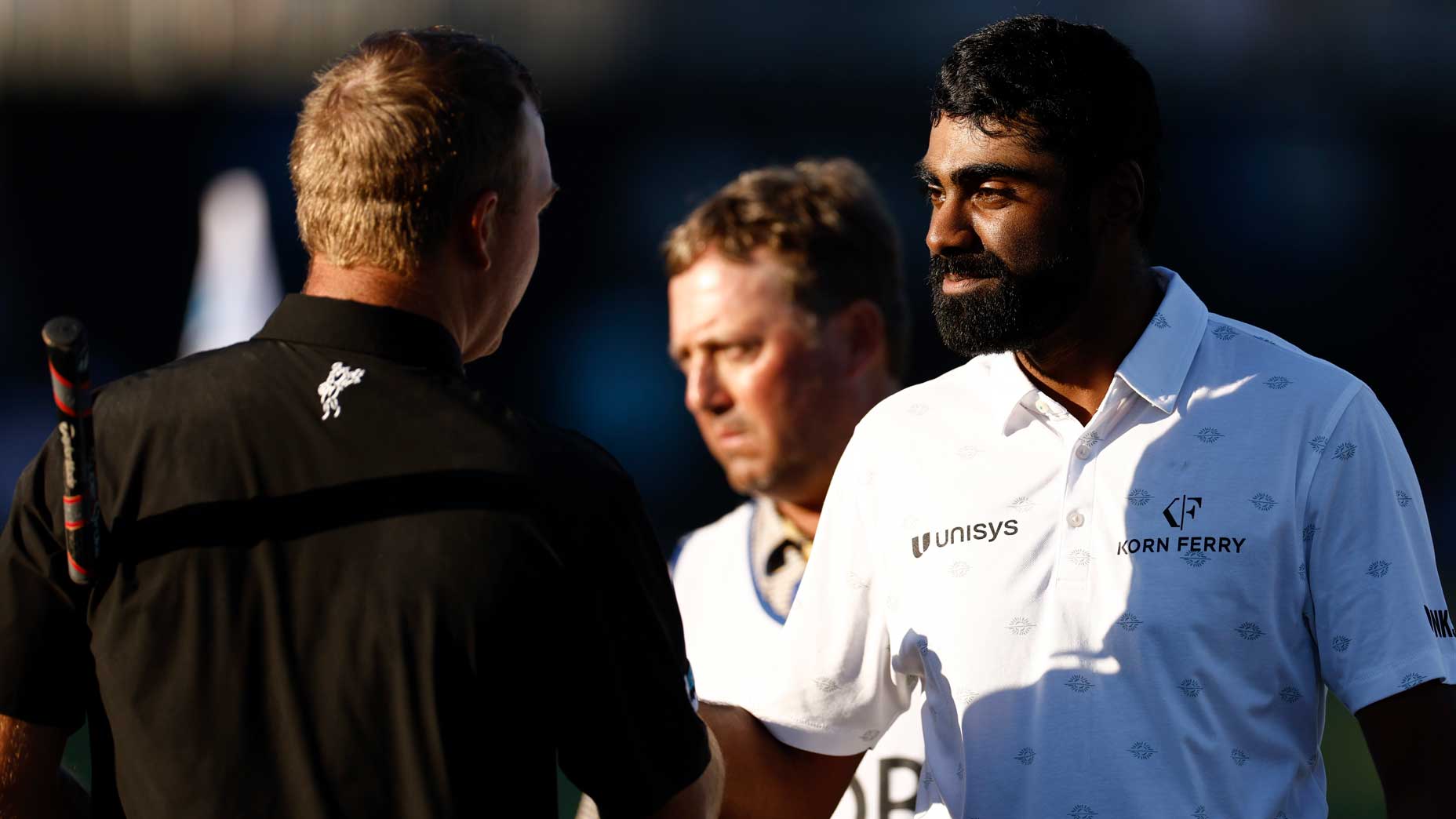 Tom Hoge and Sahith Theegala of the United States shake hands on the 18th green during round two of the QBE Shootout at Tiburon Golf Club on December 10, 2022 in Naples, Florida.