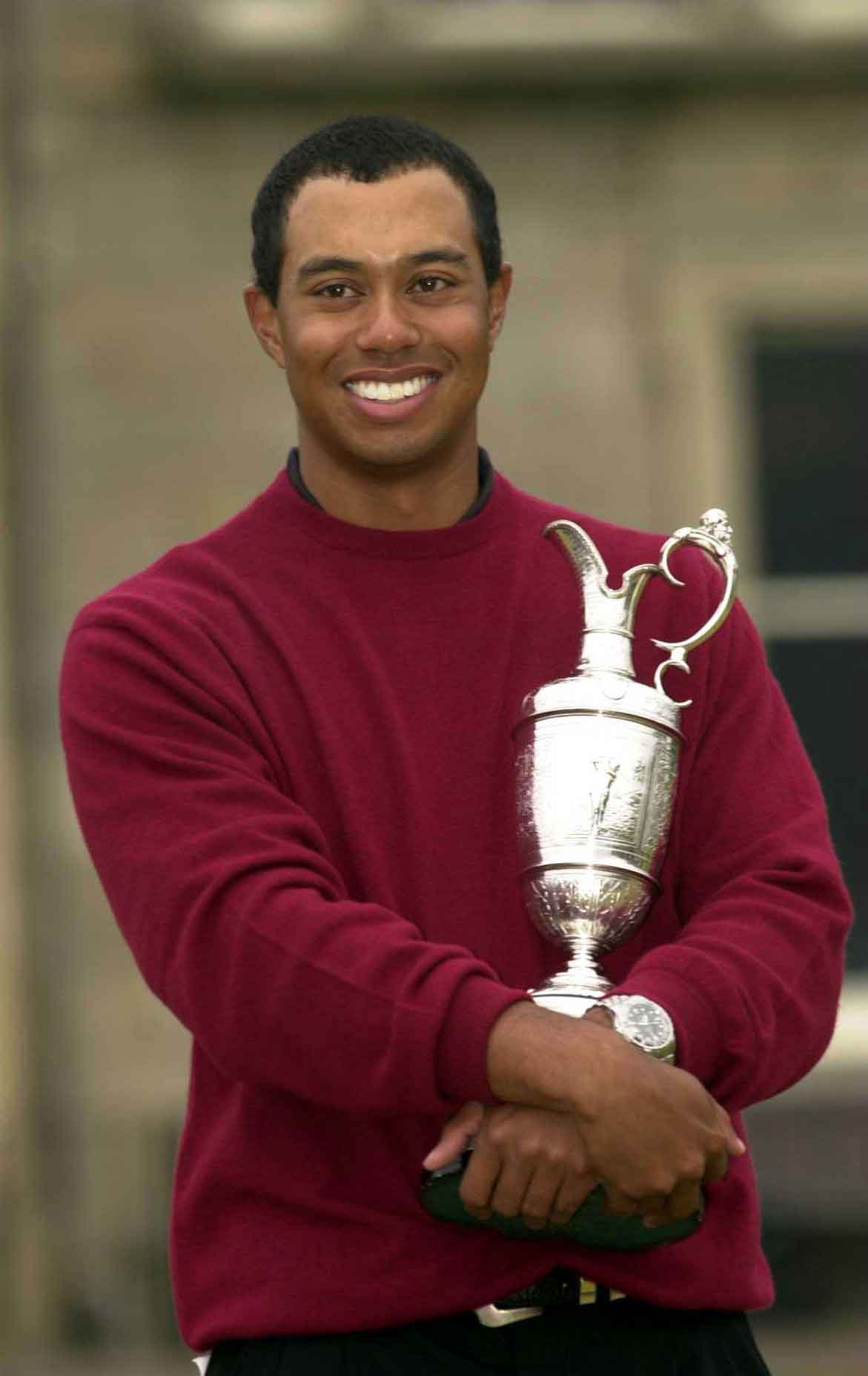 Tiger Woods holds the claret jug after his victory in the British Open Championships at the Old Course, St. Andrews, Scotland July 23, 2000.