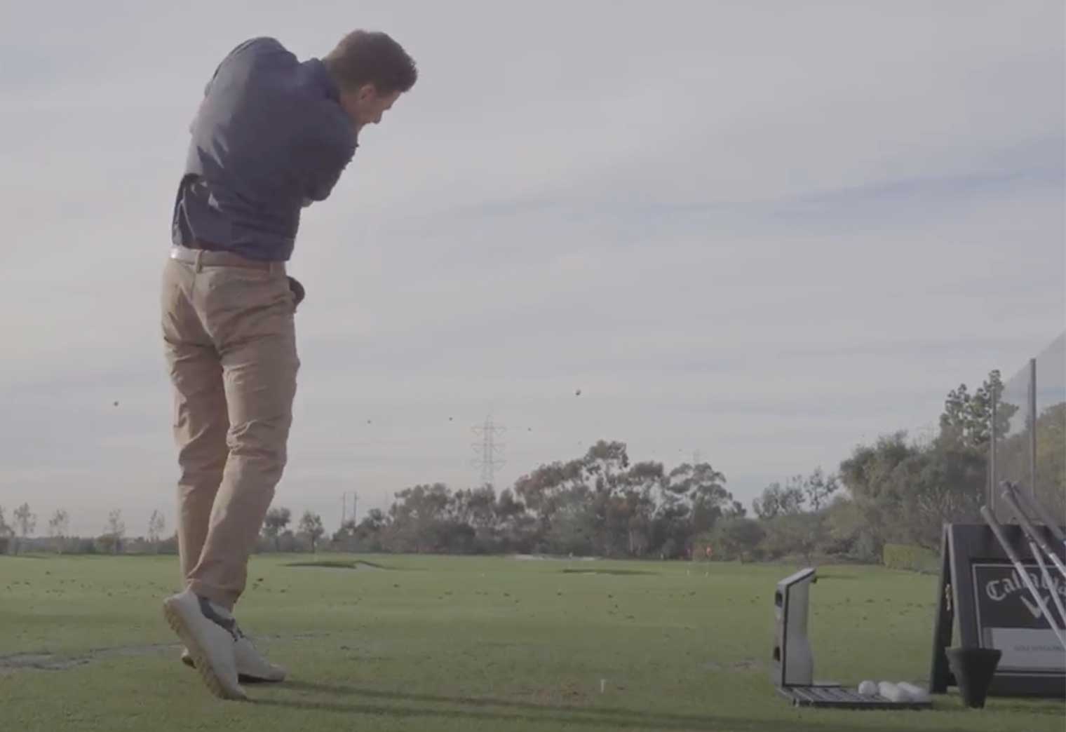 A golfer hitting a driver
